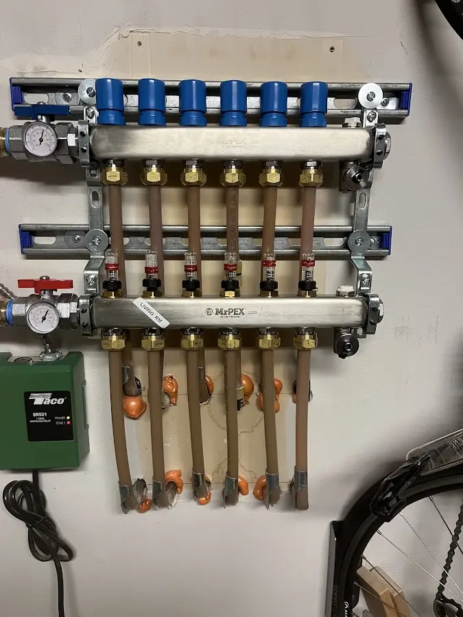 Plumber performing Water Heater Repair at a residential property in Cedar Mill